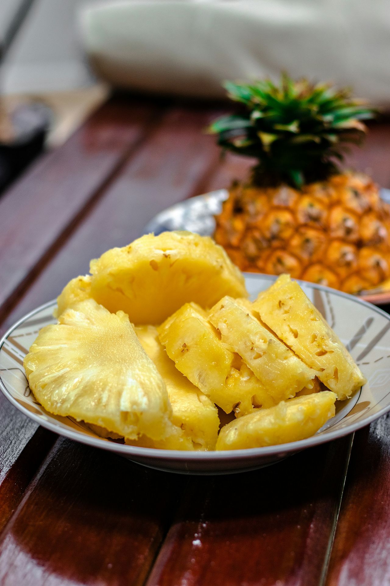 sliced pineapple on white ceramic plate