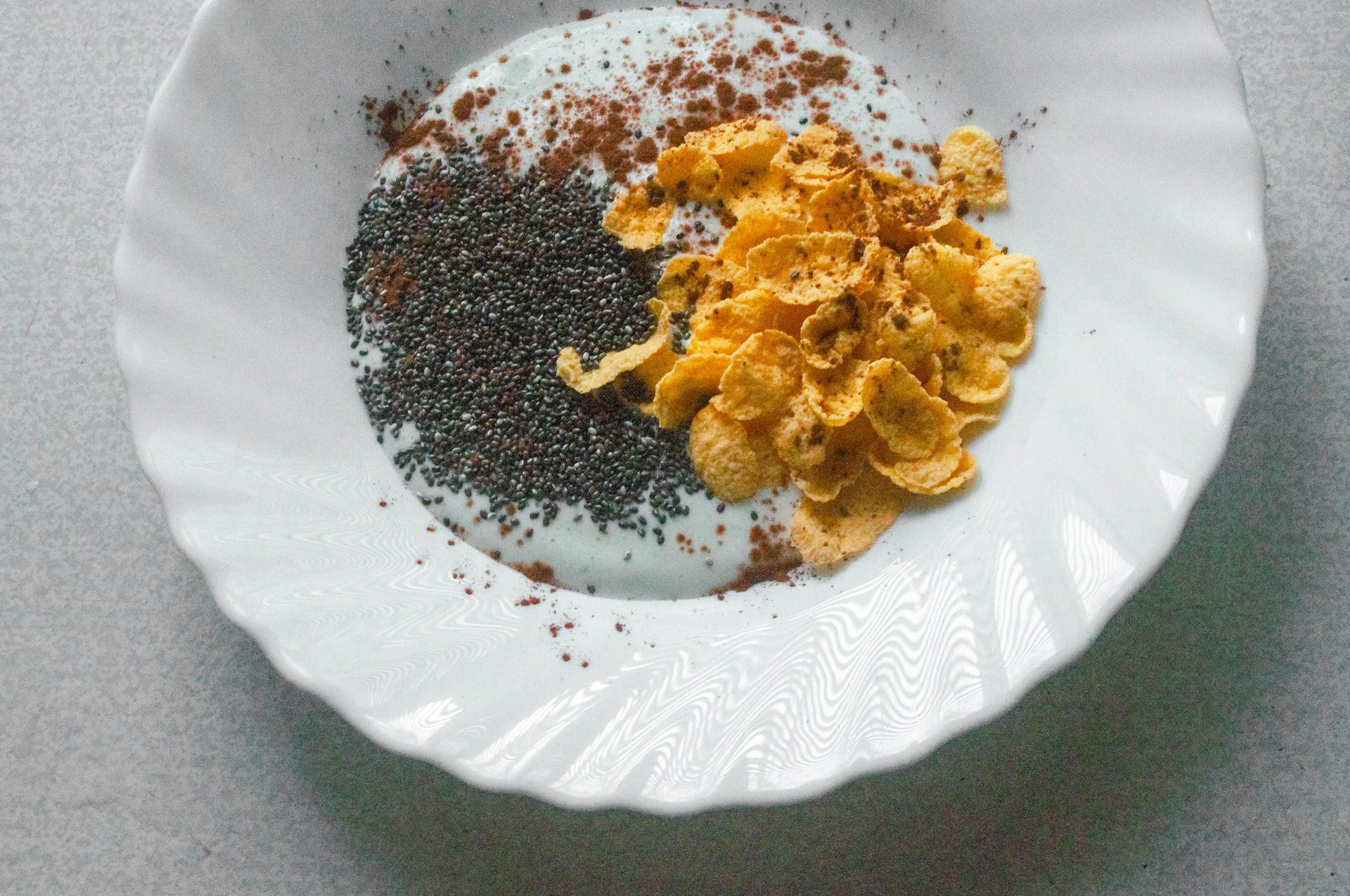 a white plate topped with cereal and other foods